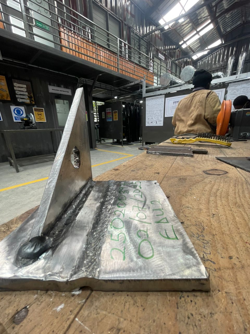 Repair of farm equipment chassis, applying arc welding techniques for durability.